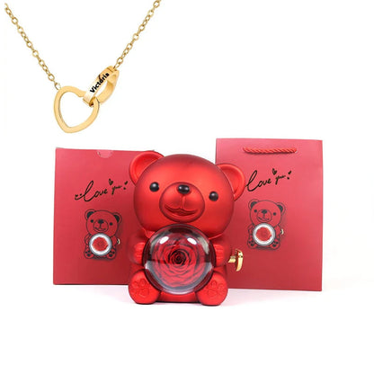 Urso Rotativo com Colar Dois Corações